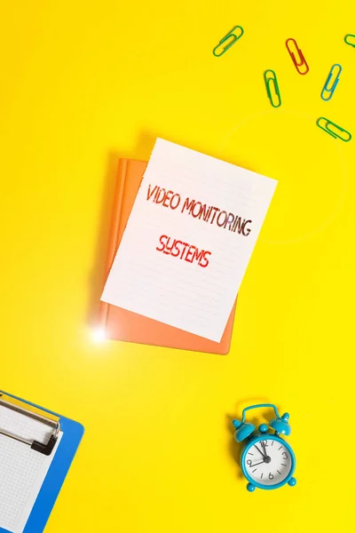 Writing note showing Video Monitoring Systems. Business photo showcasing Surveillance Transmit capture Image to Digital Link Paper clips with blank papers for text messages. — Stock Photo, Image