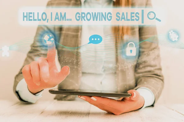 Text sign showing Hello I Am Growing Sales. Conceptual photo Making more money Selling larger quantities Female human wear formal work suit presenting presentation use smart device. — Stock Photo, Image