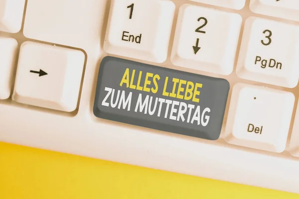 Conceptual hand writing showing Alles Liebe Zum Muttertag. Business photo showcasing Happy Mothers Day Love Good wishes Affection White pc keyboard with note paper above the white background.