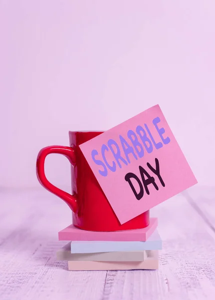 Handwriting text Scrabble Day. Concept meaning a day to celebrate the popular board game created in 1938 Coffee cup blank sticky note stacked note pads retro retro wooden table. — ストック写真