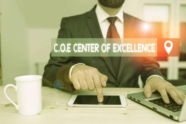 Writing note showing Coe Center Of Excellence. Business photo showcasing being alpha leader in your position Achieve.