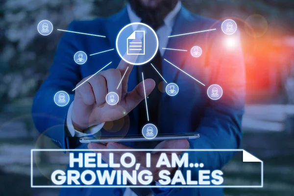 Handwriting text writing Hello I Am Growing Sales. Concept meaning Making more money Selling larger quantities Male human wear formal work suit presenting presentation using smart device. — Stock Photo, Image