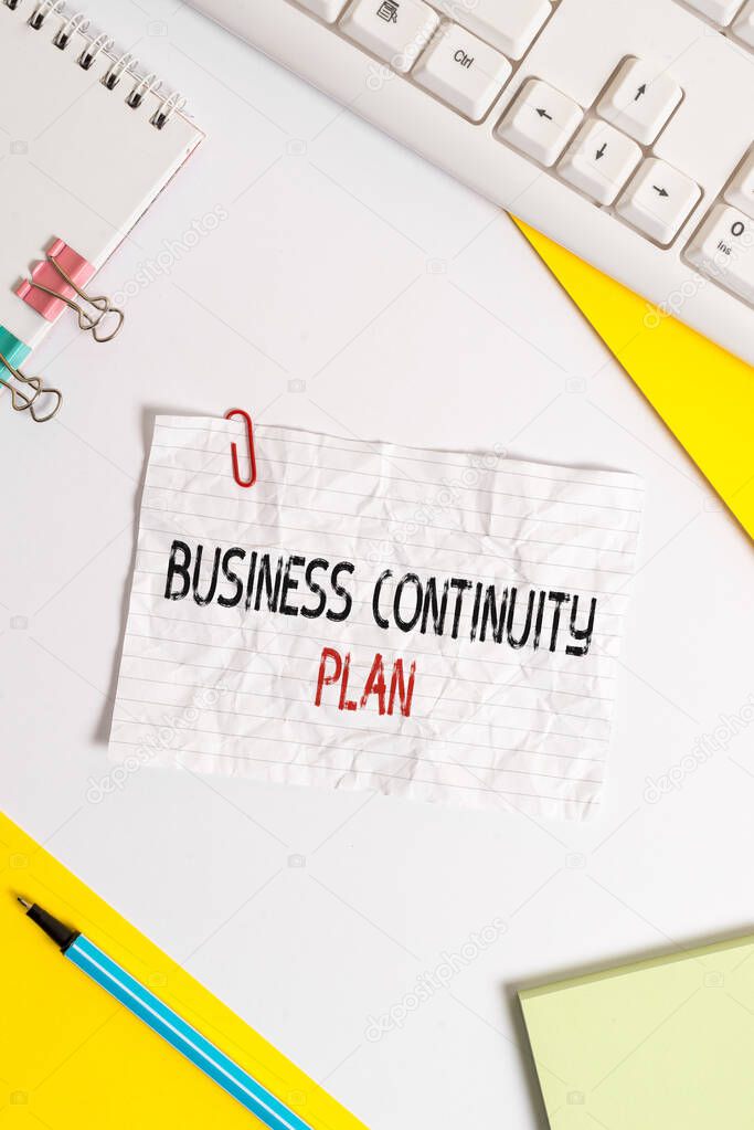 Word writing text Business Continuity Plan. Business concept for creating systems prevention deal potential threats Flat lay above table with pc keyboard and copy space paper for text messages.