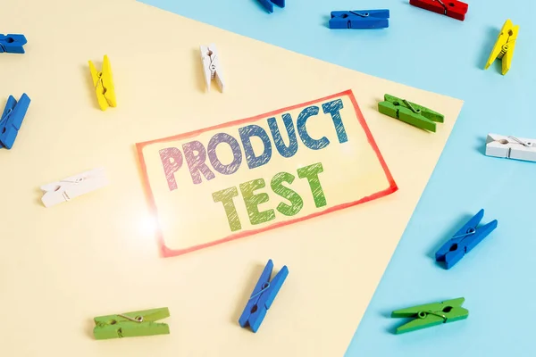 Writing note showing Product Test. Business photo showcasing process of measuring the properties or perforanalysisce of products Colored clothespin paper reminder with yellow blue background.