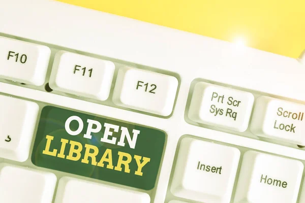 Word scrittura di testo Open Library. Business concept per l'accesso online a libri di pubblico dominio e outofprint di analisi Tastiera bianca per pc con carta a note vuote sopra lo spazio di copia del tasto di sfondo bianco . — Foto Stock