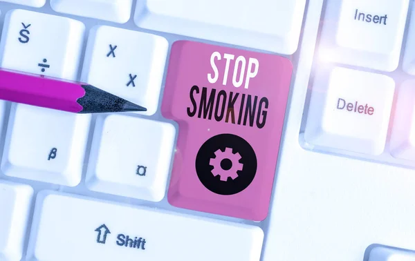 Handwriting text Stop Smoking. Concept meaning the process of discontinuing or quitting tobacco smoking White pc keyboard with empty note paper above white background key copy space. — Stock Photo, Image