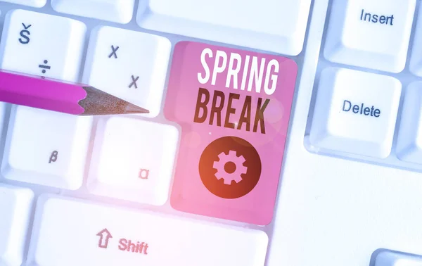 Handwriting text Spring Break. Concept meaning week s is vacation for students in the spring typically at Easter White pc keyboard with empty note paper above white background key copy space. — Stock Photo, Image