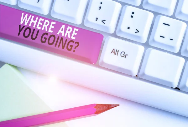 Conceptual hand writing showing Where Are You Going Question. Business photo text asking someone where he is heading to White pc keyboard with note paper above the white background.