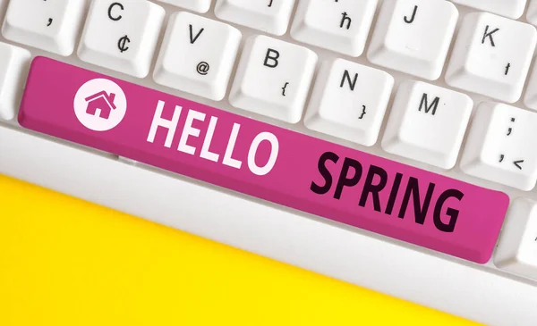 Writing note showing Hello Spring. Business photo showcasing welcoming the season of the blossoming of flowers End of winter White pc keyboard with note paper above the white background. — Stock Photo, Image