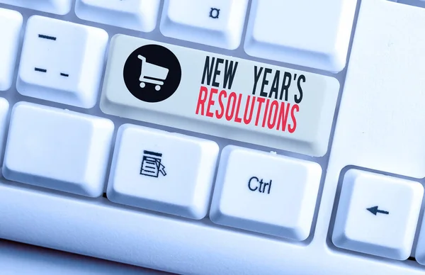 Handwriting text New Year S Resolutions. Concept meaning Wishlist List of things to accomplish or improve White pc keyboard with empty note paper above white background key copy space. — ストック写真