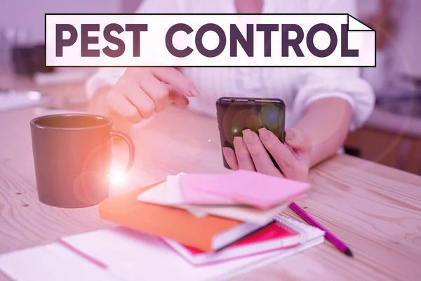 Handwriting text Pest Control. Concept meaning analysisagement of a species that impacts adversely on huanalysis woman using smartphone office supplies technological devices inside home. — Stockfoto