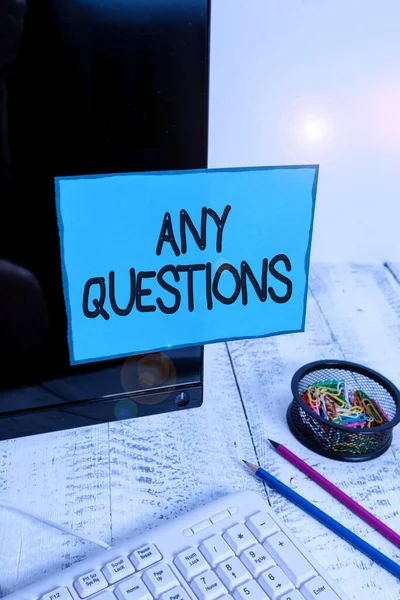 Conceptual hand writing showing Any Questions. Business photo text Clueless Blank face Inquiry Disputes Probes Issues Riddles Note paper taped to black screen near keyboard stationary. — Stockfoto