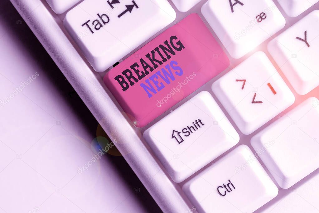 Word writing text Breaking News. Business concept for Special Report Announcement Happening Current Issue Flashnews White pc keyboard with empty note paper above white background key copy space.