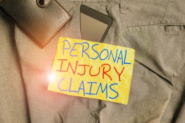 Writing note showing Personal Injury Claims. Business photo showcasing being hurt or injured inside work environment Smartphone device inside trousers front pocket with wallet.
