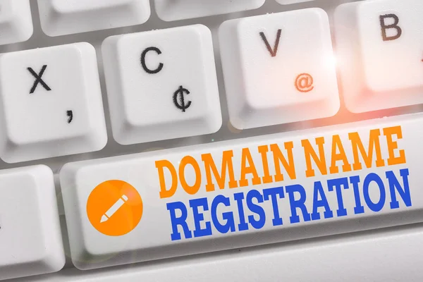 Writing note showing Domain Name Registration. Business photo showcasing Own an IP Address Identify a particular Webpage Keyboard with note paper on white background key copy space. — Stockfoto