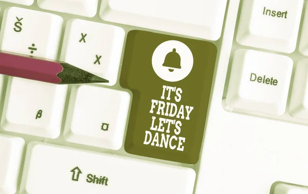 Conceptual hand writing showing It S Friday Let S Dance. Business photo showcasing Celebrate starting the weekend Go party Disco Music White pc keyboard with note paper above the white background.