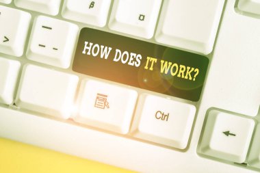 Writing note showing How Does It Work Question. Business photo showcasing Asking on how stuff being build or operates White pc keyboard with note paper above the white background.