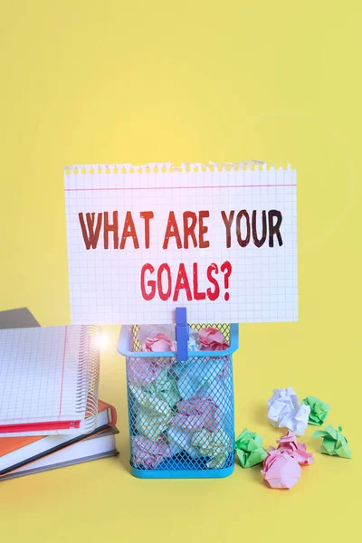 Handwriting text What Are Your Goals Question. Concept meaning ask the Desired End Results to know the plans Trash bin crumpled paper clothespin empty reminder office supplies yellow. — Stockfoto