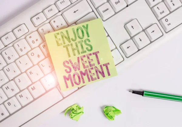 Writing note showing Enjoy This Sweet Moment. Business photo showcasing encouraging someone to love his life timeline Green note paper with pencil on white background and pc keyboard. — Stock Photo, Image