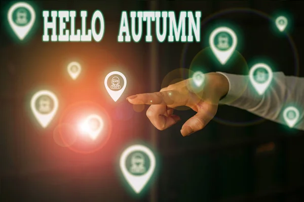 Writing note showing Hello Autumn. Business photo showcasing it is the season after summer, when leaves fall from trees Woman wear formal work suit presenting presentation using smart device. — 스톡 사진