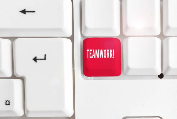 Word writing text Teamwork. Business concept for combined action of group especially when effective and efficient White pc keyboard with empty note paper above white background key copy space. — Stock Photo, Image