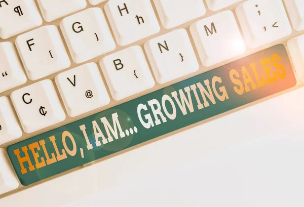 Text sign showing Hello I Am Growing Sales. Conceptual photo Making more money Selling larger quantities White pc keyboard with empty note paper above white background key copy space. — Stok fotoğraf