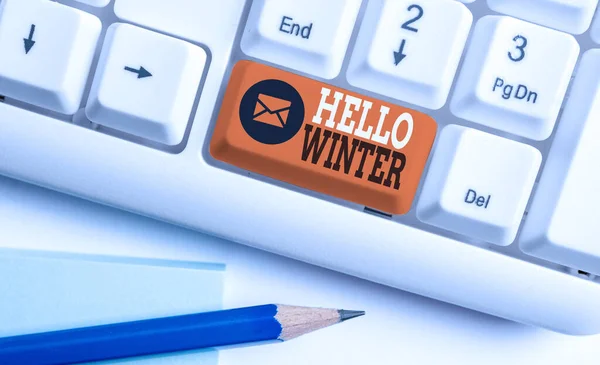 Conceptual hand writing showing Hello Winter. Business photo showcasing coldest season of the year in polar and temperate zones White pc keyboard with note paper above the white background. — ストック写真