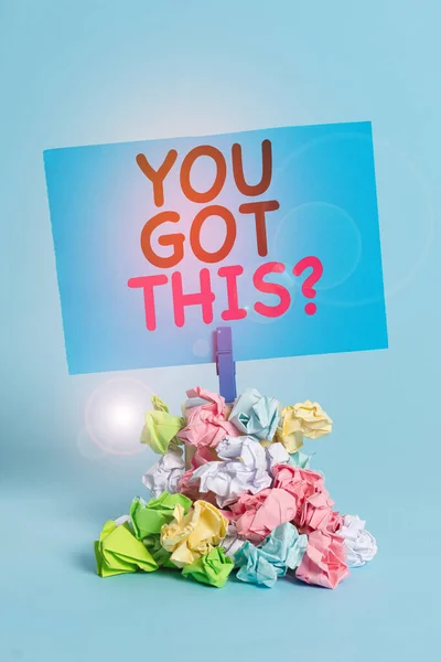 Text sign showing You Got This Question. Conceptual photo Believe that showing will succeed in doing something Reminder pile colored crumpled paper clothespin reminder blue background.