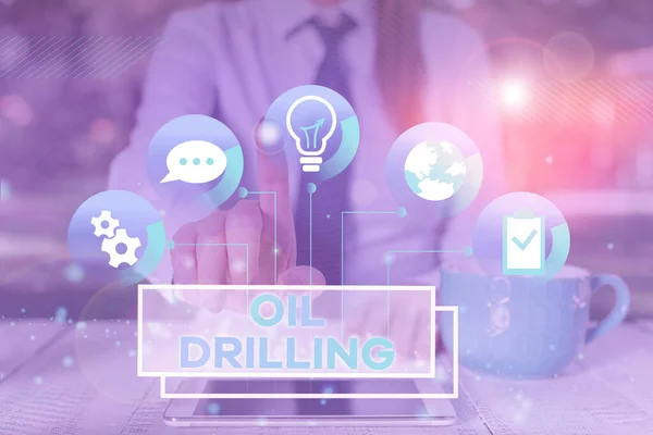 Word writing text Oil Drilling. Business concept for involves the drilling and pumping of oil from underground wells Female human wear formal work suit presenting presentation use smart device. — ストック写真