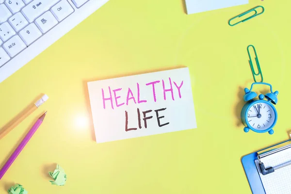 Handwriting text Healthy Life. Concept meaning one that helps to keep and improve showing s is health or condition Flat lay above copy space on the white crumpled paper. — Stok fotoğraf