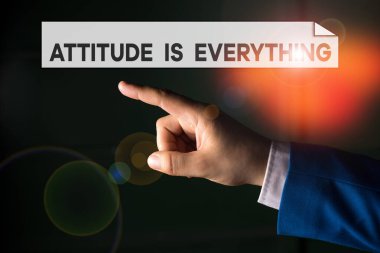 Writing note showing Attitude Is Everything. Business photo showcasing Positive Outlook is the Guide to a Good Life Isolated hand pointing with finger. Business concept pointing finger.