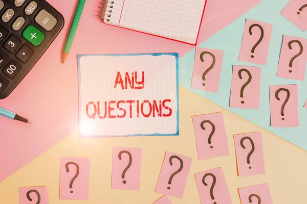 Writing note showing Any Questions. Business photo showcasing Clueless Blank face Inquiry Disputes Probes Issues Riddles Mathematics stuff and writing equipment above pastel colours background. — Stockfoto