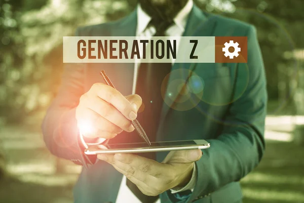 Text sign showing Generation Z. Conceptual photo name for the generation of children after the millennials Businessman in blue suite stands with mobile phone in hands. — 스톡 사진