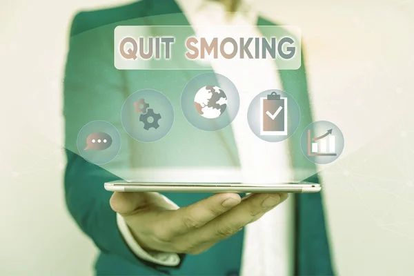 Writing note showing Quit Smoking. Business photo showcasing process of discontinuing tobacco smoking or cessation Male human wear formal suit presenting using smart device. — Stock Photo, Image