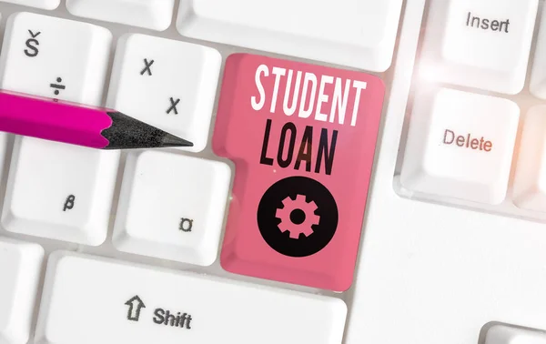 Handwriting text Student Loan. Concept meaning financial assistance designed to help students pay for school White pc keyboard with empty note paper above white background key copy space.