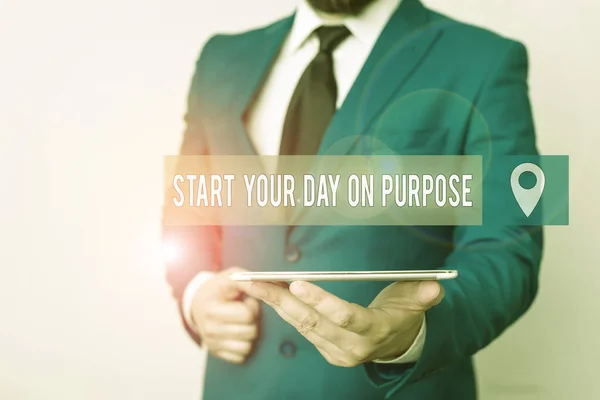 Writing note showing Start Your Day On Purpose. Business photo showcasing Have clean ideas of what you are going to do Businessman in blue suite with a tie holds lap top in hands.