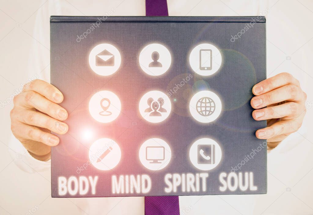 Handwriting text writing Body Mind Spirit Soul. Concept meaning Personal Balance Therapy Conciousness state of mind Male human holding thick textured cardboard of business promotion concept.