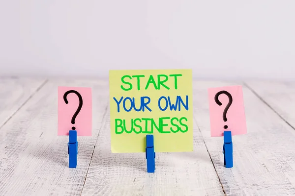 Conceptual hand writing showing Start Your Own Business. Business photo text Entrepreneurial Venture a Startup Enter into Trade Crumbling sheet with paper clips placed on the wooden table.