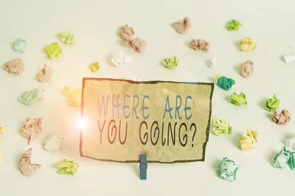 Text sign showing Where Are You Going Question. Conceptual photo asking someone where he is heading to Colored crumpled papers empty reminder white floor background clothespin.