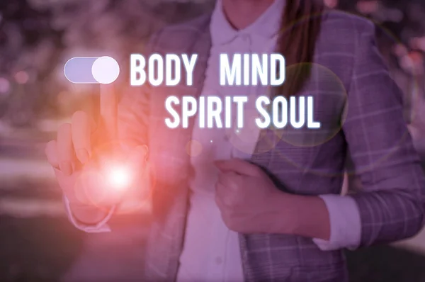 Text sign showing Body Mind Spirit Soul. Conceptual photo Personal Balance Therapy Conciousness state of mind Woman wear formal work suit presenting presentation using smart device. — Stock Photo, Image