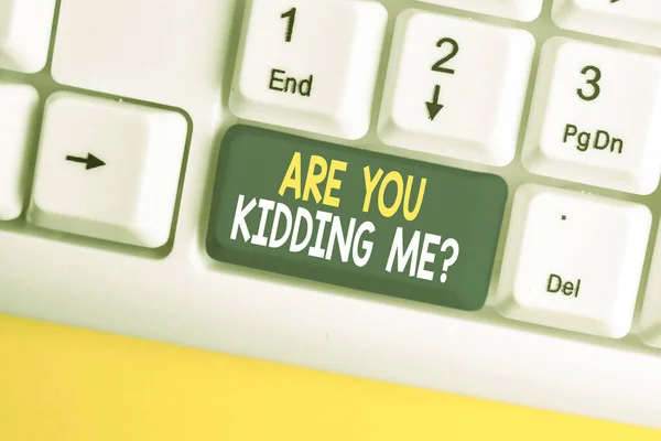 Conceptual hand writing showing Are You Kidding Me Question. Business photo showcasing Expression of Disbelief or could not be true White pc keyboard with note paper above the white background. — Stockfoto