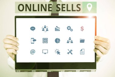 Word writing text Online Sells. Business concept for sellers directly sell goods or services over the Internet Male human holding thick textured cardboard of business promotion concept.