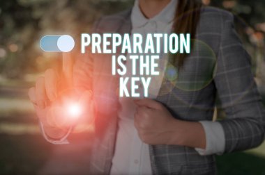 Text sign showing Preparation Is The Key. Conceptual photo action of making something ready for service or use Woman wear formal work suit presenting presentation using smart device.