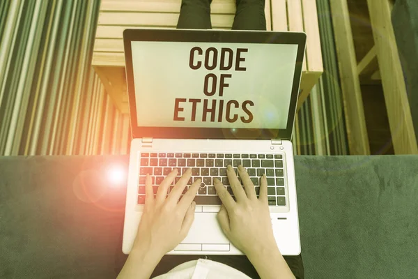 Writing note showing Code Of Ethics. Business photo showcasing basic guide for professional conduct and imposes duties woman laptop computer office supplies technological devices inside home. — Stock Photo, Image