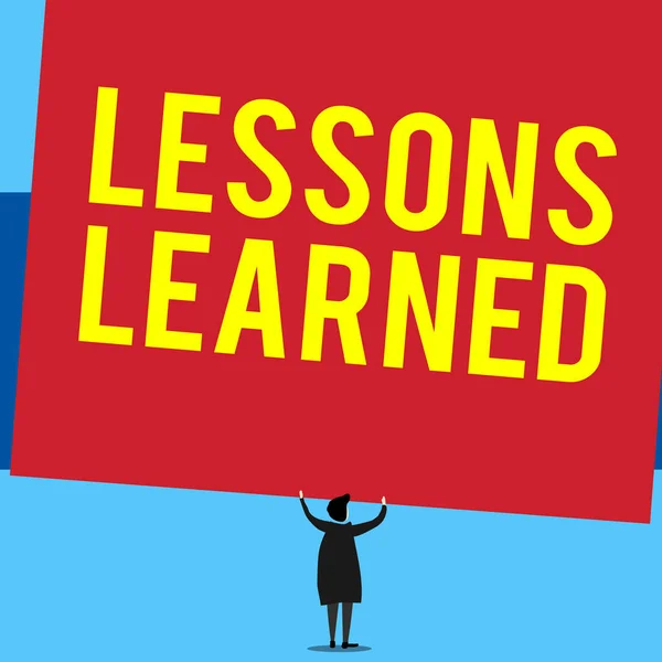 Writing note showing Lessons Learned. Business photo showcasing the knowledge or understanding gained by experience Short hair woman standing dress hands up holding blank rectangle. — Stockfoto