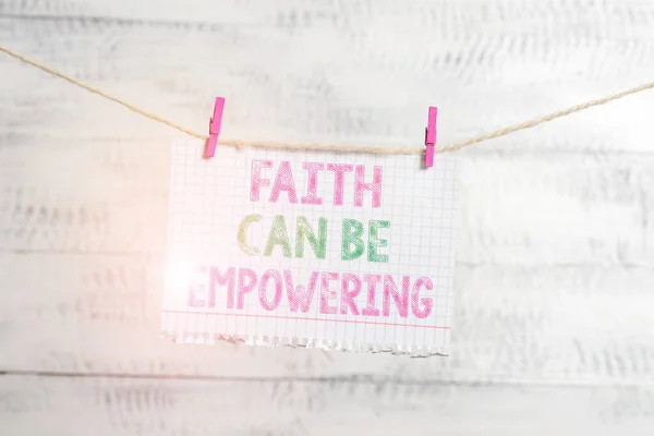 Writing note showing Faith Can Be Empowering. Business photo showcasing Trust and Believing in ourselves that we can do it Clothesline clothespin rectangle shaped paper reminder white wood desk. — ストック写真