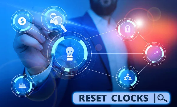 Word writing text Reset Clocks. Business concept for To revisit return to or recreate a time or era from the past Male human wear formal work suit presenting presentation using smart device. — Stok fotoğraf