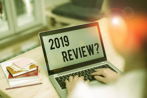 Text sign showing 2019 Review Question. Conceptual photo remembering past year events main actions or good shows woman laptop computer office supplies technological devices inside home. — Stockfoto