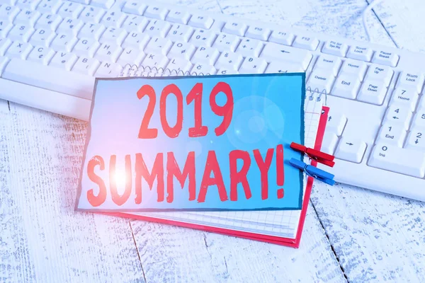 Handwriting text 2019 Summary. Concept meaning summarizing past year events main actions or good shows notebook paper reminder clothespin pinned sheet white keyboard light wooden. — 스톡 사진