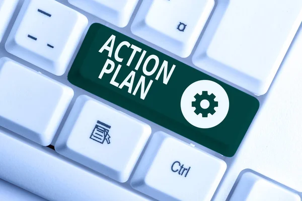 Writing note showing Action Plan. Business photo showcasing detailed plan outlining actions needed to reach goals or vision White pc keyboard with note paper above the white background.
